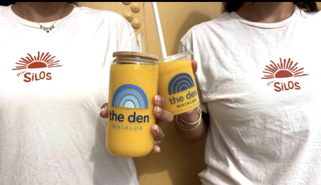 Two members in The Silos tees holding mango smoothies at the Health Bar