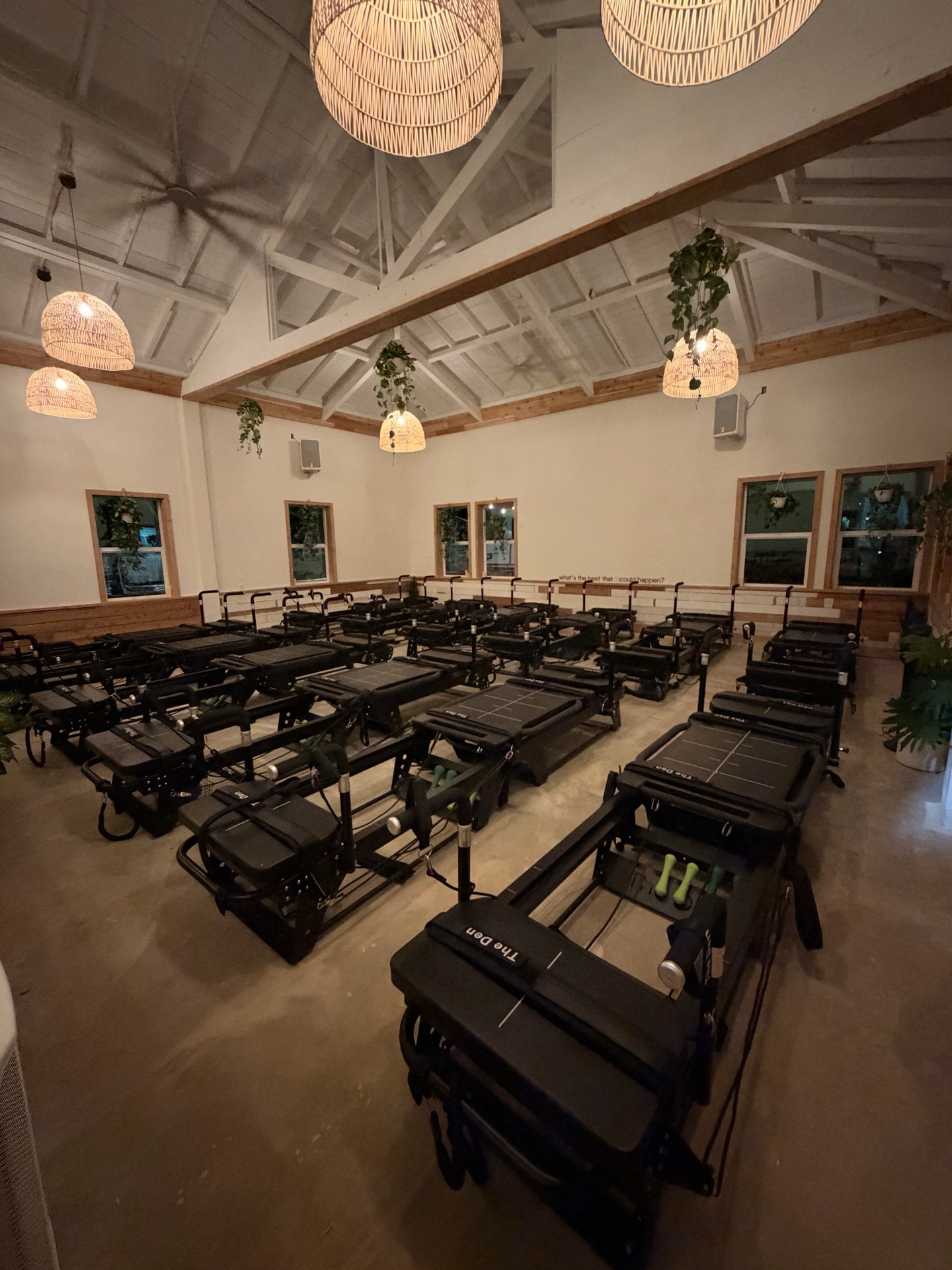 Twelve reformers under the vaulted ceiling of the old sugar mill at The Den Kahuku