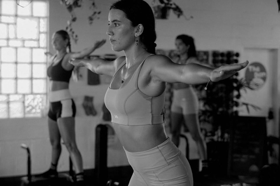 Arms extended on the reformer during the RVCA shoot