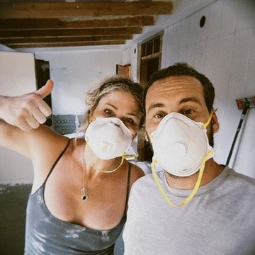 Chelsey and Kona in dust masks during the Haleʻiwa build-out