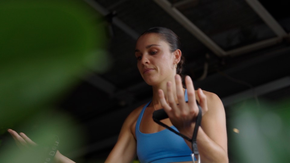 An instructor coaching at The Den Haleʻiwa